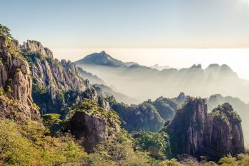 Huangshan refracts sunlight above the clouds.