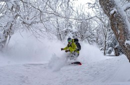 A snowboarder explores the backcountry outside of Bolton Valley ski area in Vermont.