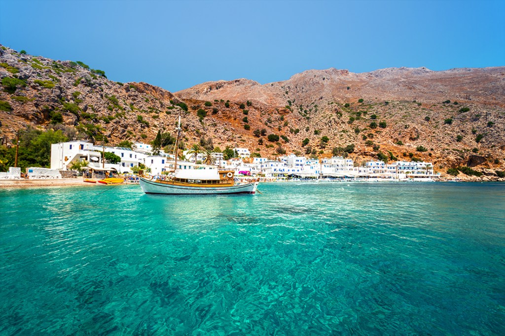 Aquamarine waters lap against the small fishing village of Loutro.