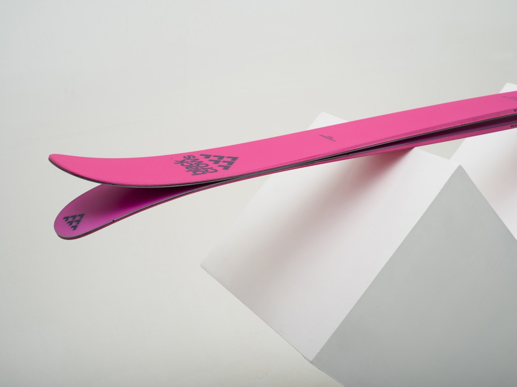 The Corvus Freebird ski rests on a white block.