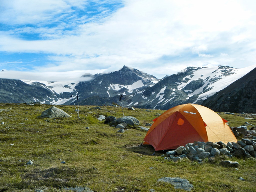 A tent doubles as basecamp in the middle of the Coast Mountains wilderness.