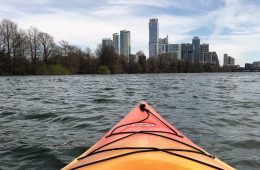 A kayak faces the skyline of downtown Austin.