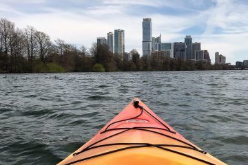 A kayak faces the skyline of downtown Austin.