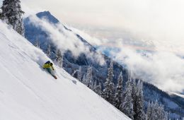 A skier rides powder at Revelstoke, British Columbia.