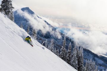 A skier rides powder at Revelstoke, British Columbia.