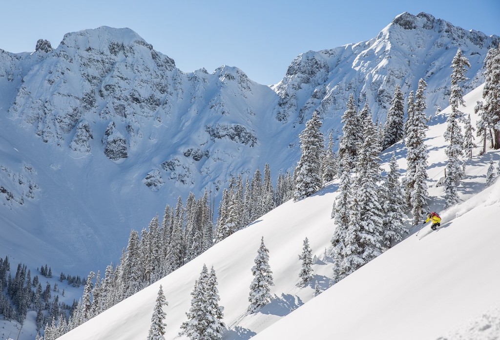 A skier takes fresh turns through untracked snow at Silverton Mountain.