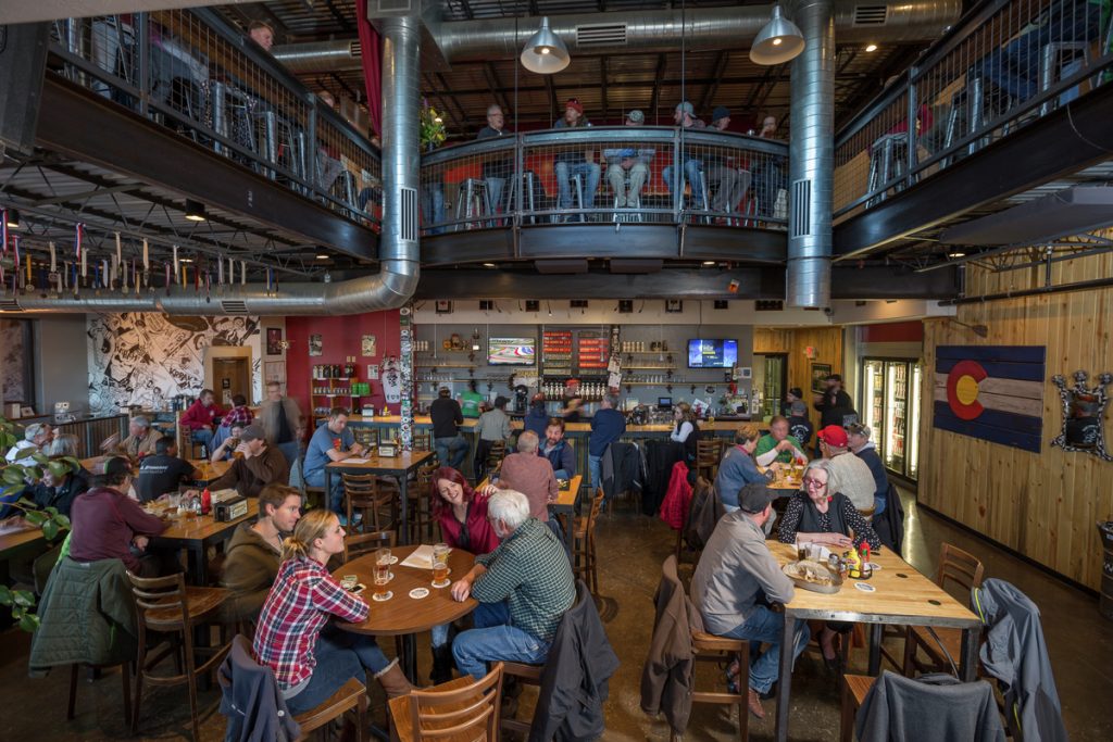 Locals and visitors intermingle and enjoy craft brew at the Ska Brewing tasting room.