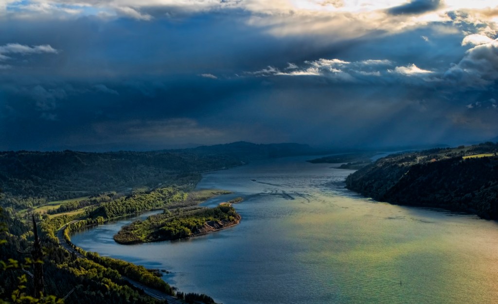 Stormy clouds above a dreamy river.