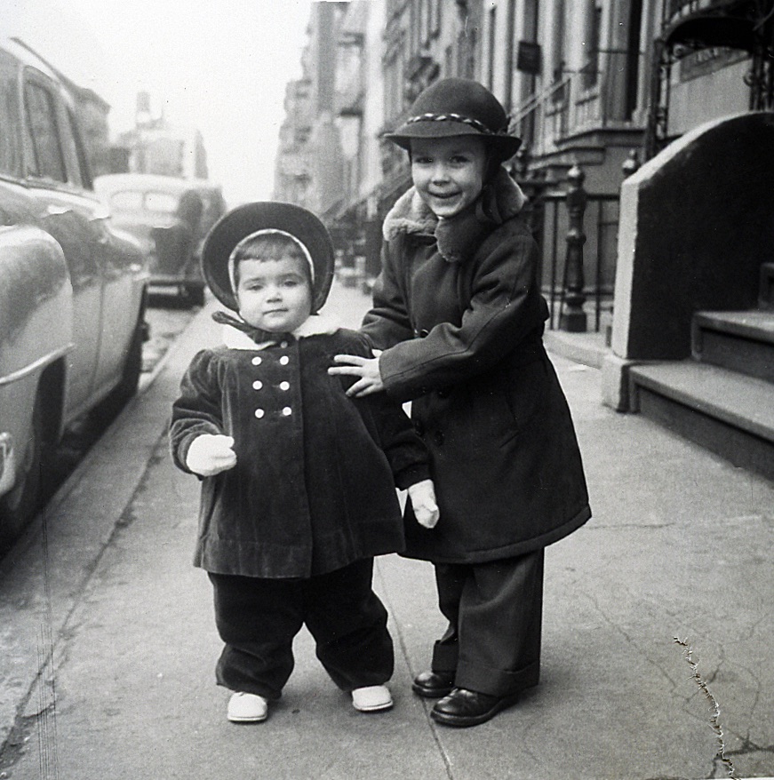 Dierdre Wolownick as a child poses with her brother John in front of the family Manhattan brownstone.