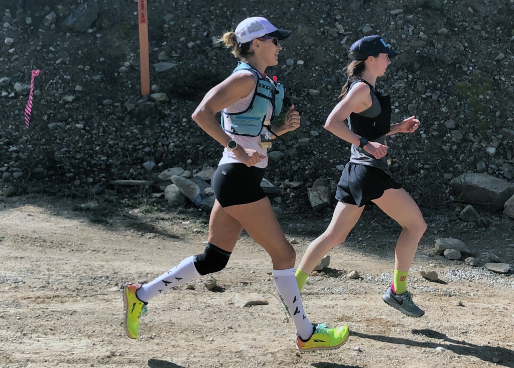 Kara Goucher runs on a dirt road at the Leadville Marathon.