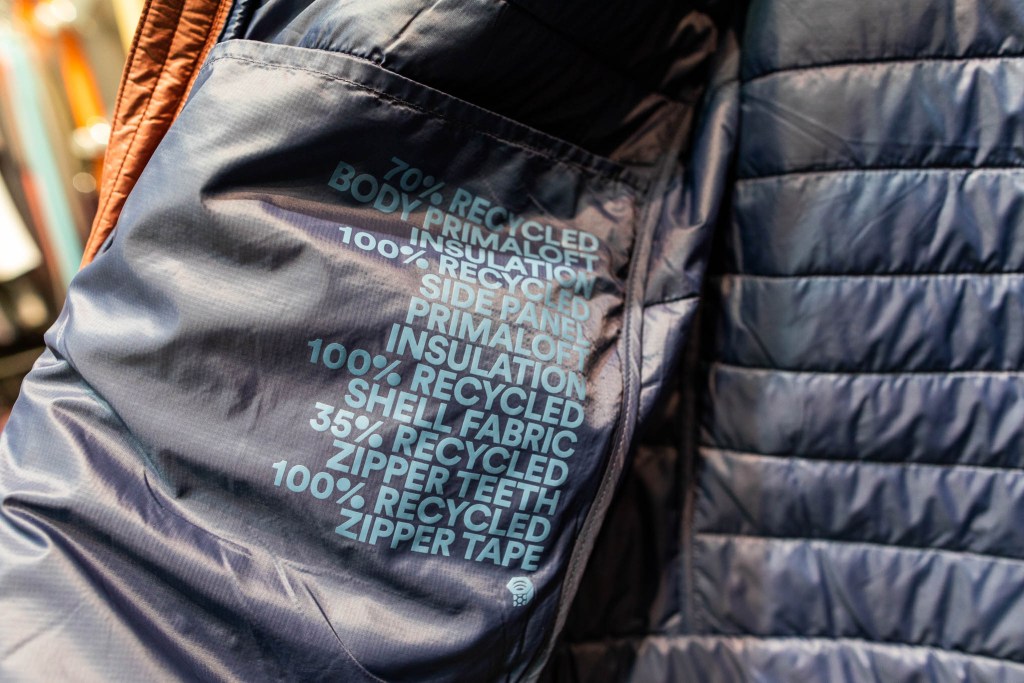 The inside of the Mountain Hardwear jacket shows what percent of the fabric comes from recycled materials.
