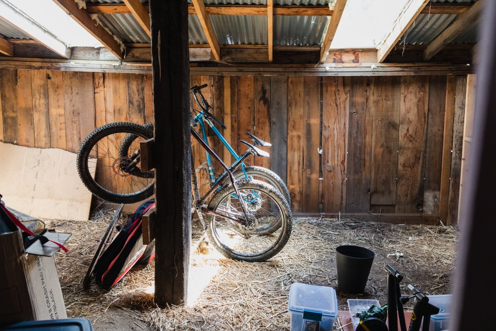 Bikes hang in the back room of the barn.