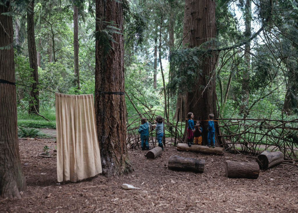 Children play games in an improvised forest classroom