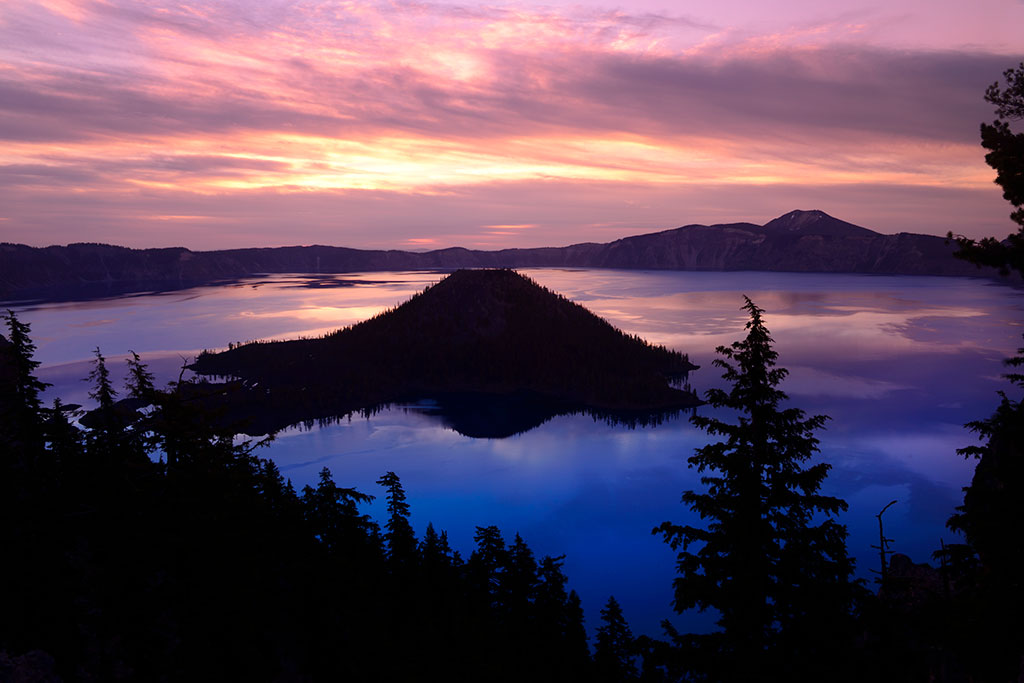 Wizard Island rises from the waters of Crater Lake. 