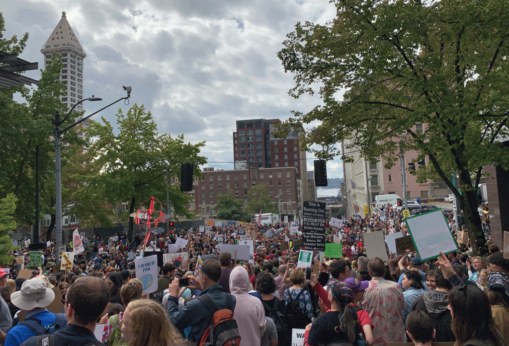 Demonstrators make their way toward Seattle City Hall
