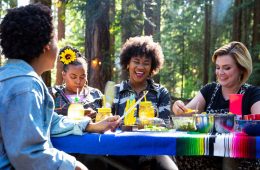 Campworthy hosts and guests eating vegetarian pozole