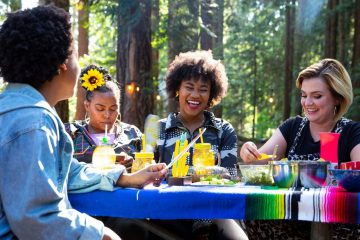 Campworthy hosts and guests eating vegetarian pozole