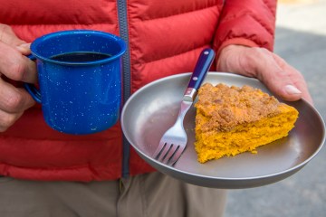 Slice of pumpkin coffee cake with coffe