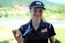 Evy Leibfarth brandishes a gold medal