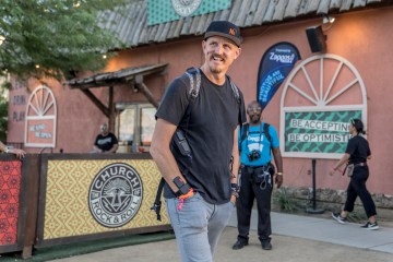 Mick Ebeling standing in front of the camera and smiling.