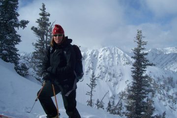 A hiker stands in front of a peak outside Salt Lake City