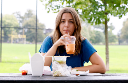 Erin Sullivan eating lunch, astounded by how much single-plastic is part of the meal