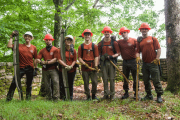 A group of Naval stewards poses for the camera