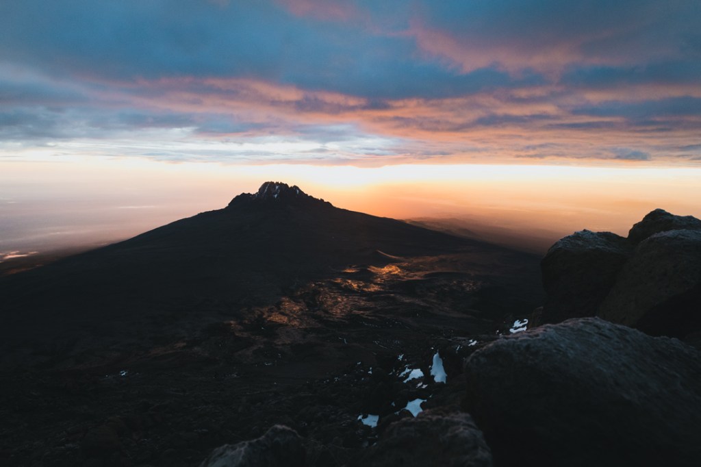 A pink, white and blue sunrise over Kilimanjaro's Rongai route.