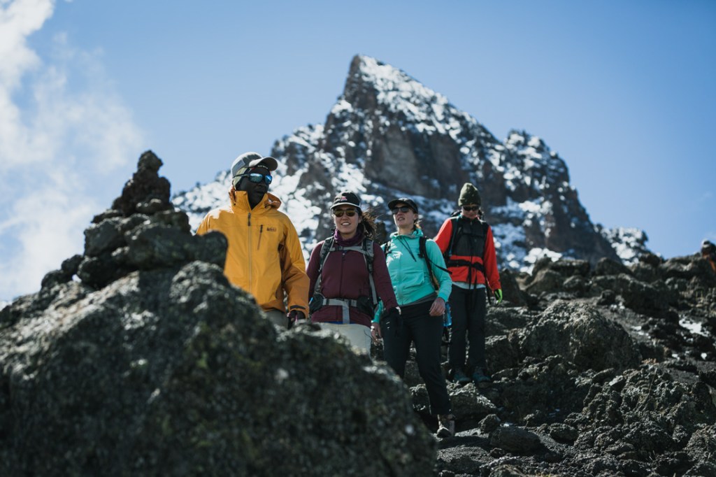 Climbers in a jagged landscape on the way Kilimanjaro's summit.