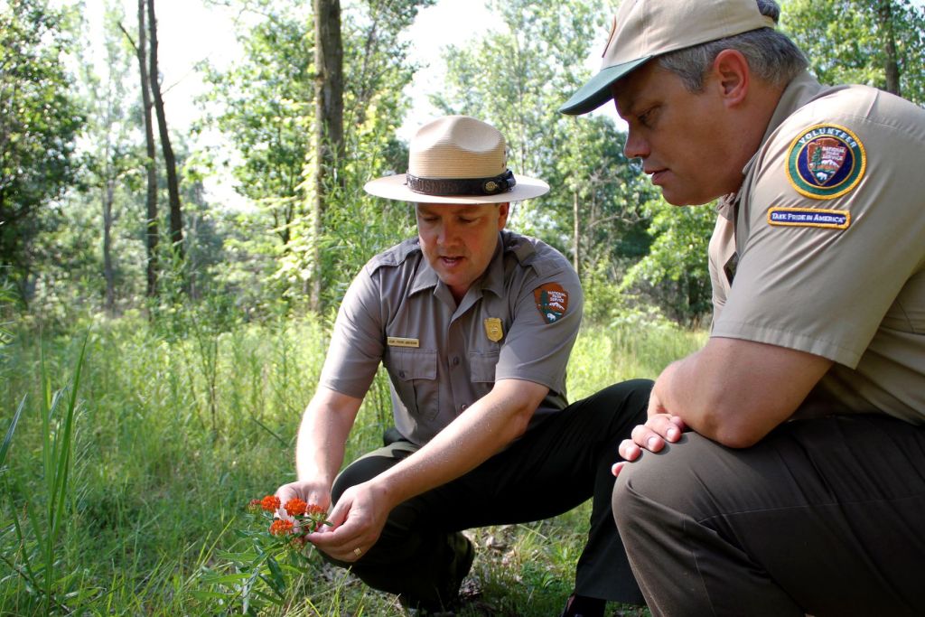 Volunteer Program Manager James Whitenack trains one of the few thousand volunteers who keep Indiana Dunes' programs running and its trails in good condition. 