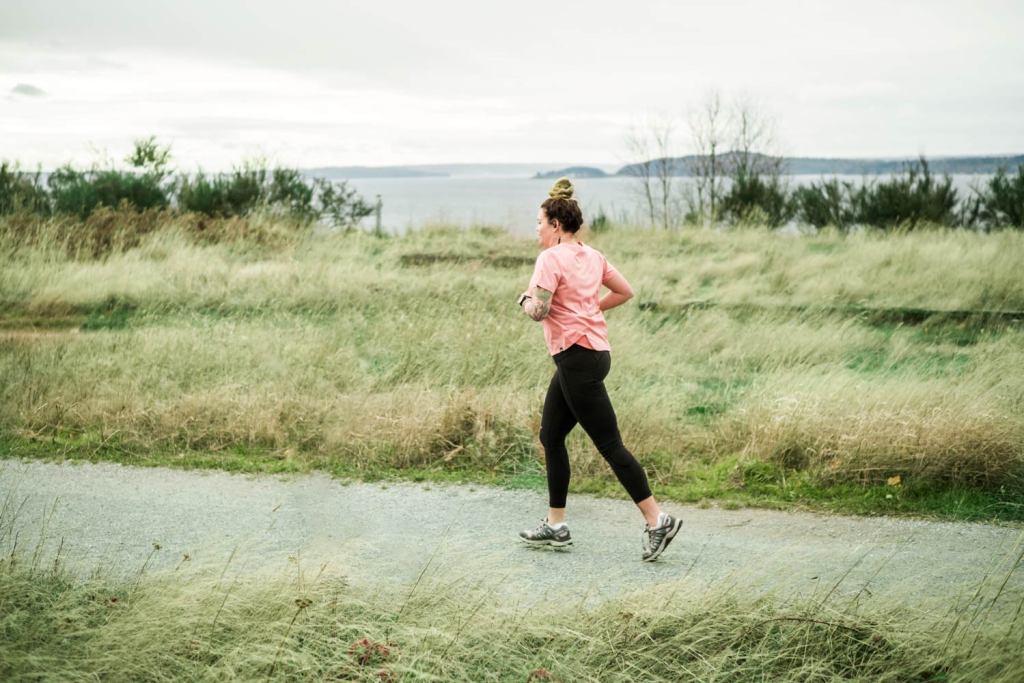 a runner along the trail in an urban park