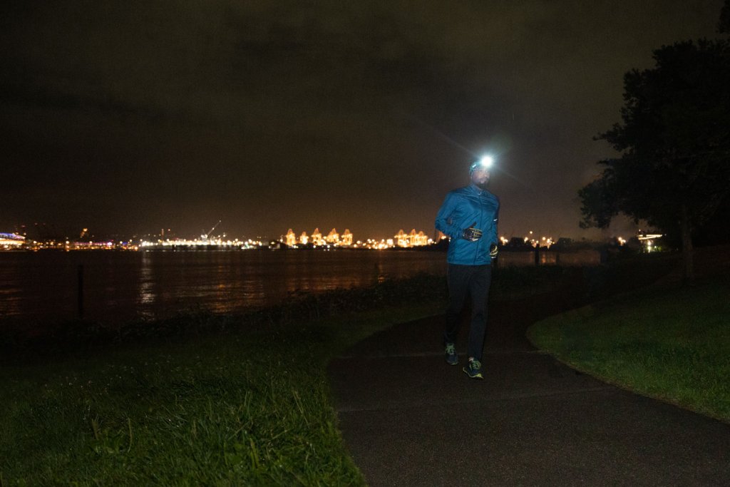a runner running an urban trail at night