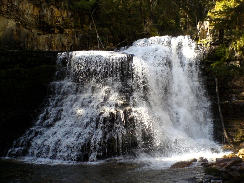 A heavy flow of water tumbles over Ousel Falls.