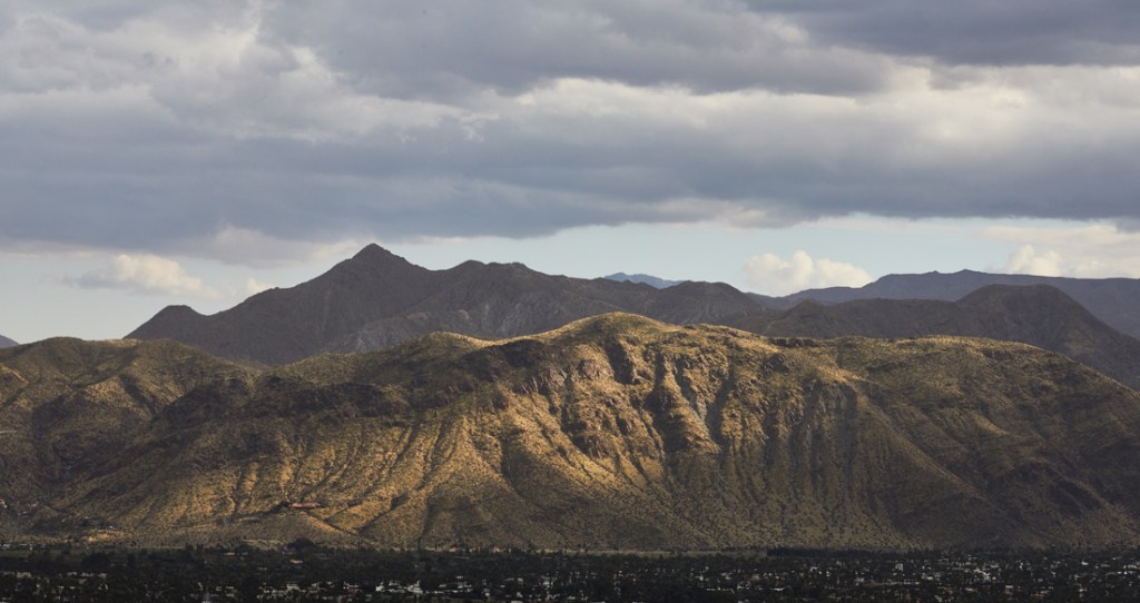 A break in the clouds about the mountains neat Palm Springs.