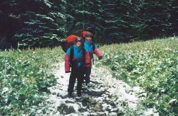 Two young children on a backpacking trip