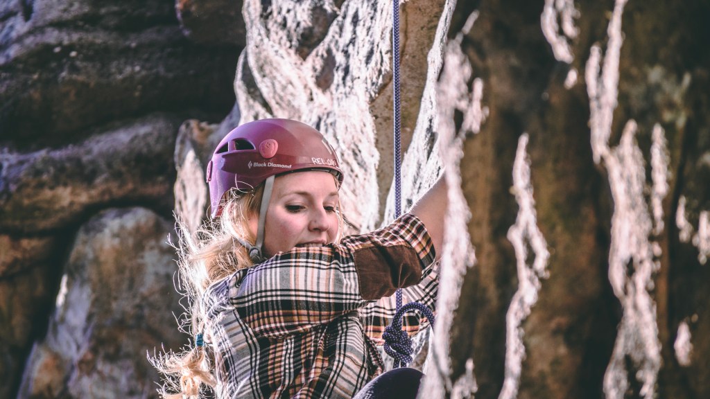Woman rock climbing.