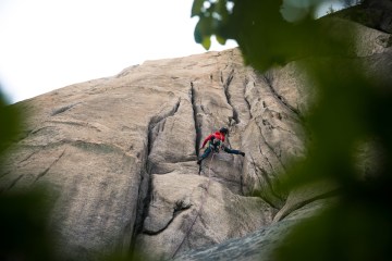 Shelma Jun climbing on a rock face in South Korea.