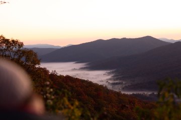 Hikers looking out over a river valley