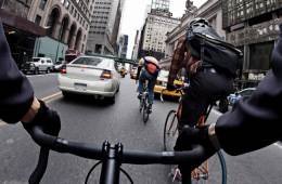 bike messengers biking through traffic