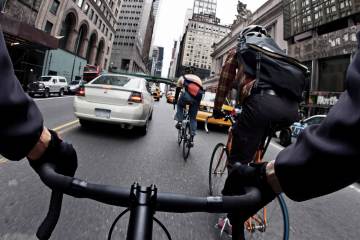 bike messengers biking through traffic