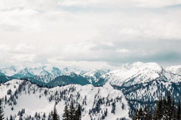 Snowcapped peaks with a white sky above