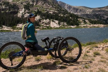 Quinn Brett enjoys a reflective mountain panorama at Lawn Lake