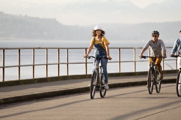 three people biking