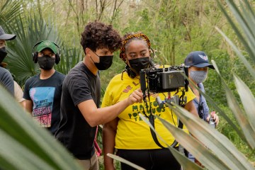 Angela Tucker looking at the camera while filming The Trees Remember.