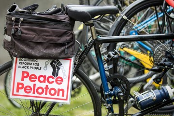 Bicycle with a Peace Peloton sign attached to the rear fender