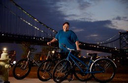 Person standing in front of three bikes during nighttime