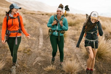 Three hikers on a dusty doubletrack