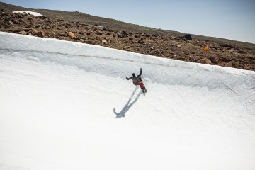 A snowboarder on a halfpipe
