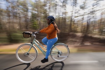 A person riding a bike on a bike path.