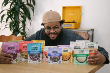 Ibraheem Basir is pictured with a line of A Dozen Cousins products